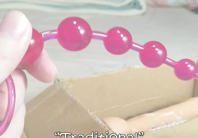 Cute tranny DaniTheCutie tries using traditional anal beads on her pretty lil butt