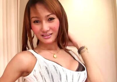 Busty Asian shemale in black lingerie pulls out a trimmed dick