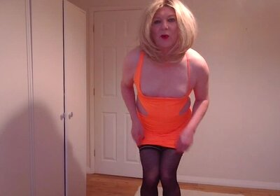 Orange minidress, black stockings and high heels