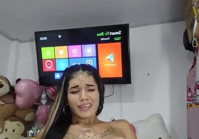 Tattooed Latina shemale cum