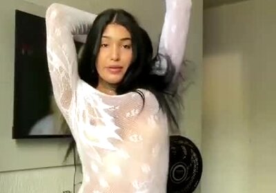 Sexy latina Trans loves stripping away her see through dress for her fans