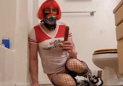 Cosplay Sissy in chastity riding her dildo