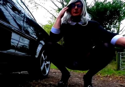 Amateur crossdresser Kellycd2022 in black dress and pantyhose outdoors