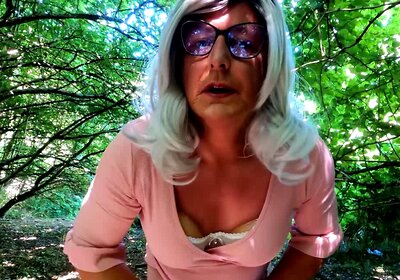 Crossdresser Kellycd2022 masturbating in pink in the woods