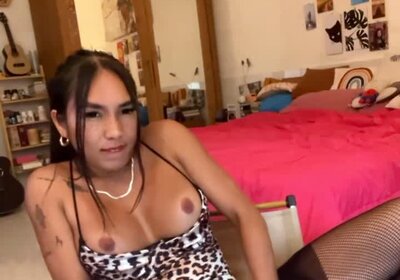 Asian Transgirl is fucking herself with a dildo and cumming