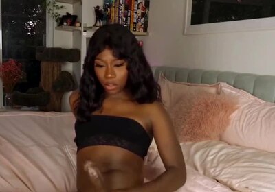 Ebony shemale makes a cumming mess on her face