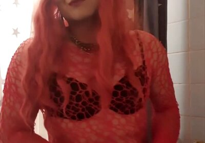 Red Sissy plays with her clit and cum
