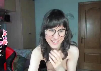 Shemale grips her shaft firmly with her thumb.